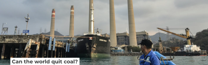 A fisherman looks at the Suralaya coal-fired power plant in Cilegon, Indonesia, in 2023. Ronald Siagian/AFP via Getty Images